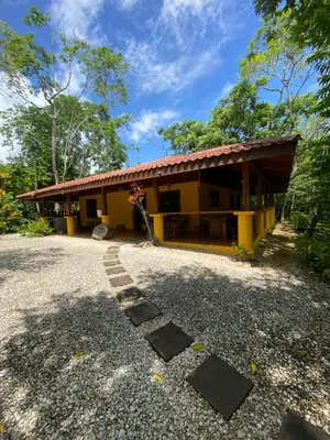 a house with a gravel road in front of it at Casa de la Naturaleza in Cóbano