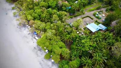 an aerial view of a tropical island with palm trees at Buena Vista Plus in Quepos