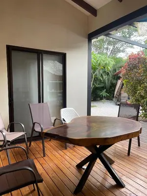 a wooden table and chairs on a wooden deck at Casita Mar Y Posa in Potrero