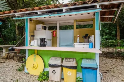 a play kitchen with three trash cans in front of it at Casita Mar Y Posa in Potrero