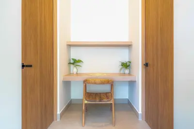 a small desk in a room with a chair at Casa Frenchie with Private Guesthouse - by Pura Villas in Dominicalito