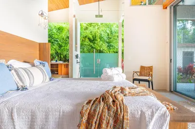 a bedroom with a large bed and a large window at Casa Grande del Mar - by Pura Villas in Punta Mala