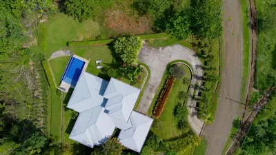 an overhead view of a building in a field at Hacienda Jaguar - by Pura Villas in Ojochal