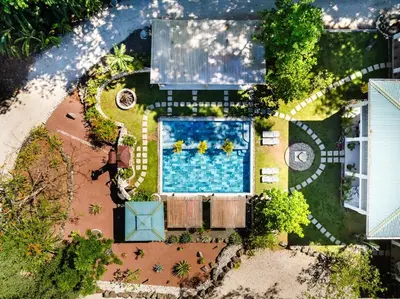 an overhead view of a swimming pool in a backyard at Buendía Lux Mango Suite Stylish Retreat with Pool Near Beach in Potrero