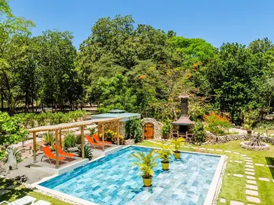 an outdoor swimming pool with a gazebo at Buendía Lux Mango Suite Stylish Retreat with Pool Near Beach in Potrero