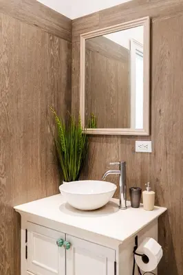 a bathroom with a white sink and a mirror at Buendía Lux Mango Suite Stylish Retreat with Pool Near Beach in Potrero
