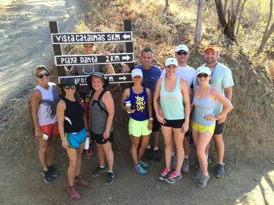 a group of people standing in front of a sign at Plaza Mercado 22 At Las Catalinas in Playa Danta