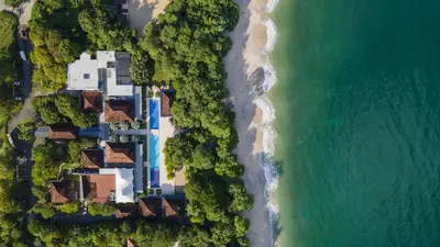 an aerial view of a house next to the beach at Adults Only 3BR Condo with Partial Ocean View - Carao - Reserva Conchal in Playa Conchal