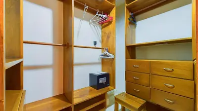 a walk in closet with a dresser and aabinet at Casa Tropical, Spacious 3 Bedroom Home in Brasilito