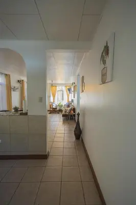 a hallway leading to a living room and a kitchen at Mahale House - Manuel Antonio, Quepos in Quepos