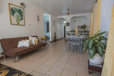 a living room with a couch and a table at Mahale House - Manuel Antonio, Quepos in Quepos