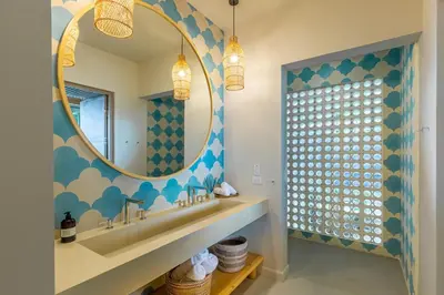a bathroom with a sink and a mirror at New Beachfront House - Casa Aura in Santa Teresa Beach