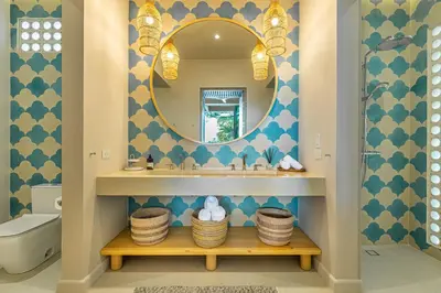 a bathroom with a sink and a mirror at New Beachfront House - Casa Aura in Santa Teresa Beach