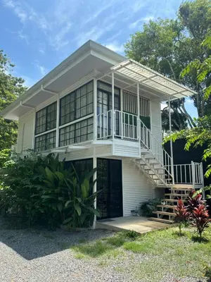 a house with a staircase in front of it at Casa Mar 2 Manzanillo St Teresa in Boca de Ario