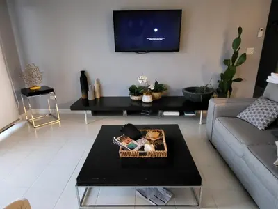 a living room with a couch and a table at Jaco Bay 4903 Three bdrm Suite Spectacular Views Pool in Jacó
