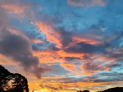 a sunset with clouds in the sky at Mi Casa Su Casa Monteverde in Monteverde Costa Rica