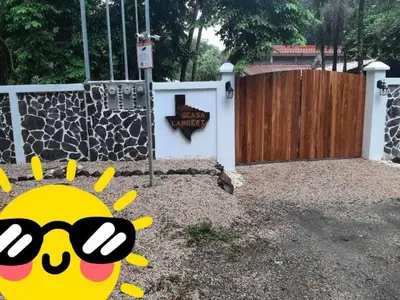 a fence with a cartoon sun in front of a gate at Apartamento LAMBERT in Playa Pelada