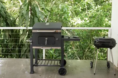 a grill and a bbq smoker on a patio at Tropical Casa Ventanas with private pool in MA in Quepos