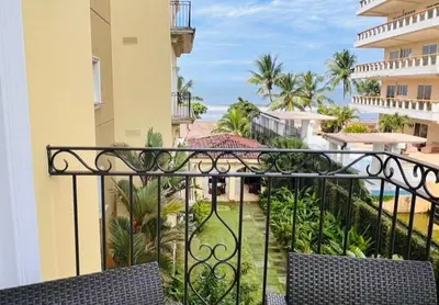 a balcony with a view of a resort at Acqua Residences 5 Star in Jacó