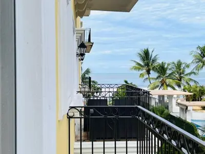 a balcony of a building with a view of the ocean at Acqua Residences 5 Star in Jacó