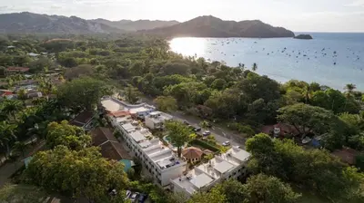 an aerial view of a town next to the water at Pacific Sunset Ground Unit Condo across the beach in Coco