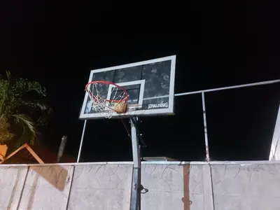 a basketball hoop on top of a fence at Casas Doña Juanita in Jacó