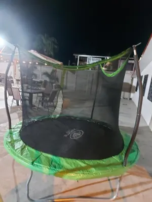 a trampoline with a net on top of it at Casas Doña Juanita in Jacó