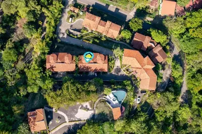 an overhead view of a house with a yard at Stylish Villa with Brand-New Furniture, Panoramic Ocean Views, and Infinity Swimming Pool & Hot Tub in Potrero