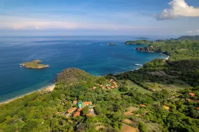 an aerial view of an island in the ocean at Stylish Villa with Brand-New Furniture, Panoramic Ocean Views, and Infinity Swimming Pool & Hot Tub in Potrero