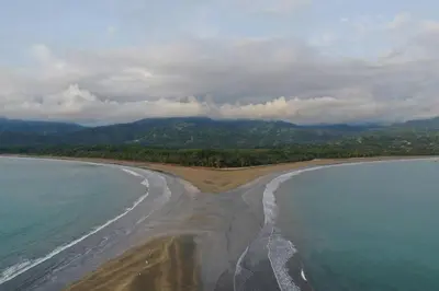an aerial view of a beach with the ocean at Sharma Costa Rica - Heliconia Casita in Uvita