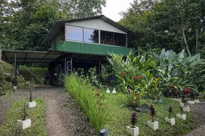 a green house with a lot of plants in front of it at Tropical Quiet Retreat in Venecia