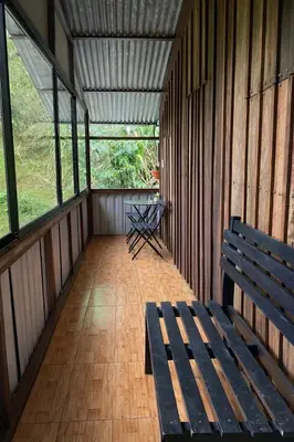 an empty room with a bench and a table at Tropical Quiet Retreat in Venecia