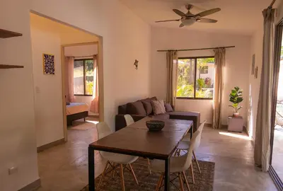 a living room with a table and a couch at MY - Cosy Lodges in Paraíso