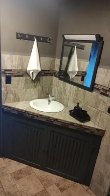 a bathroom counter with a sink and a mirror at Yarumo Lodge, Río Celeste Black Chalets in Bijagua