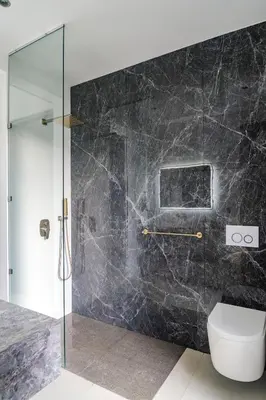 a bathroom with a glass shower and a toilet at KUNUK- Walk to Hermosa beach in Santa Teresa Beach
