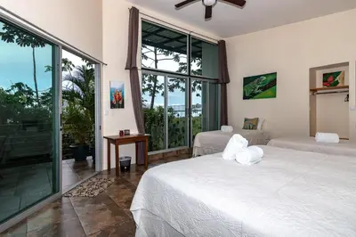 a bedroom with two beds and a large window at Hotel Finca 360 in Marsella