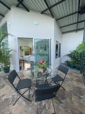 a patio with a glass table and chairs at Hotel Finca 360 in Marsella