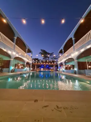 a large swimming pool in a building at night at Toro Blanco in Coco