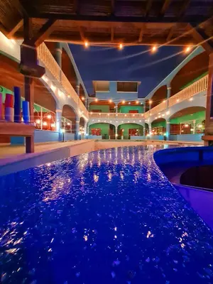 a large swimming pool in a building at night at Toro Blanco in Coco