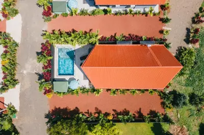 an overhead view of a house with an orange roof at Kaluma Villas in San Ramón