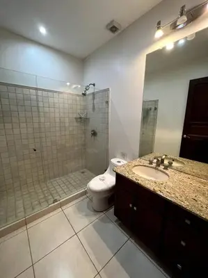 a bathroom with a shower and a toilet and a sink at 1 Bedroom with pool and walking distance to beach in Tamarindo