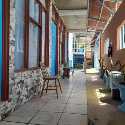 a chair sitting in the middle of a hallway at Hotel La Uvita in Puerto Limón