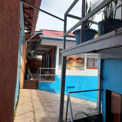 a view of the outside of a house at Hotel La Uvita in Puerto Limón