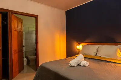 a bedroom with a bed with a towel on it at Finca Murillo in Monteverde Costa Rica