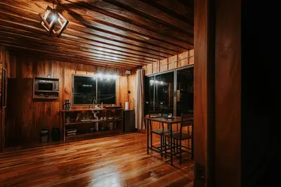 a room with wooden floors and a wooden ceiling at Finca Murillo in Monteverde Costa Rica