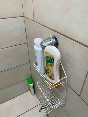 a rack with cleaning products on a bathroom wall at Beach Bliss - 1BR Villa with Pool 2 blocks from ocean in Jacó