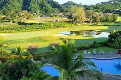 a view of the golf course at a resort at Casita Del Mar in Herradura