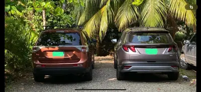 two cars are parked next to each other at Apto Cielo Azul in Manuel Antonio