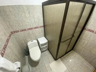 a bathroom with a toilet and a shower stall at Apto Cielo Azul in Manuel Antonio
