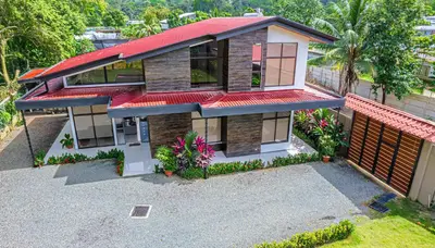 an overhead view of a house with a red roof at Hector House in Uvita
